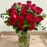 Two Dozen Roses In a Vase